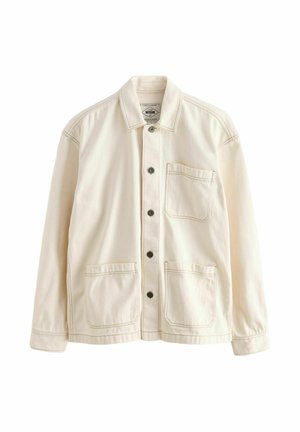 Light beige jacket made of canvas. Features a button-up front, a collar, two front pockets, and contrasting stitching. Classic relaxed fit.