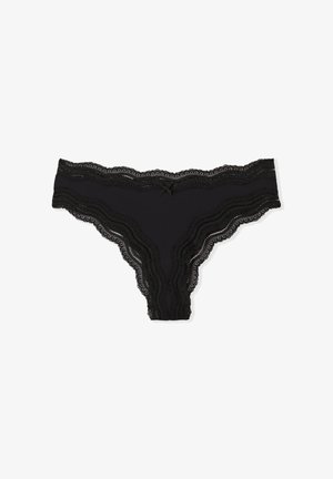 Culotte en dentelle noire avec des bords festonnés et un petit nœud central, fabriquée dans un tissu lisse au toucher doux.