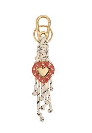 Llavero dorado con borlas de cordón beige anudado y un colgante rojo en forma de corazón grabado con las letras "BIMBA Y LOLA".