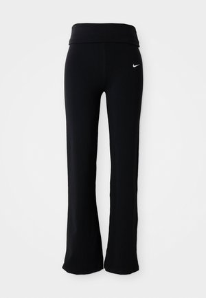 Black athletic pants with a wide waistband, made of a smooth, stretchy material. Features a small, white Nike logo on the hip.