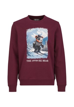 Bordeauxrode sweatshirt met een cartoonbeer met skikleding die op besneeuwde bergen skiet, met de tekst "THE 19V69 SKI BEAR" onder de afbeelding.