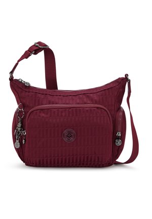 Burgundy crossbody bag made of textured nylon, featuring a zippered main compartment, front pocket, and decorative hardware accents.