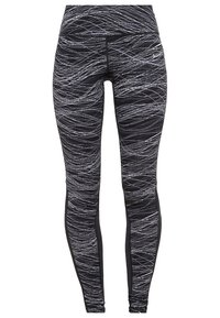 Černé legíny s vířivým bílým vzorem, vyrobené z elastického materiálu, s vysokým pasem a přiléhavým střihem.
