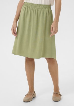 Green, knee-length skirt with an elastic waistband. Made of lightweight fabric, featuring a subtle texture and a smooth finish.
