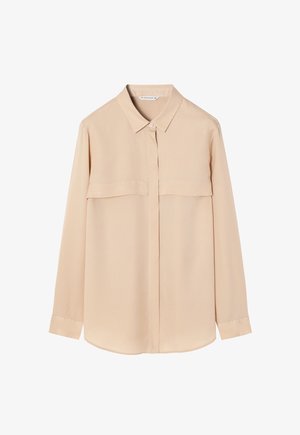 Bēša garām piedurknēm krekls gludā audumā ar apkakli, priekšējo pogu aizdari un divām krūšu kabatām. Taisna apakša ar pogātām aprocēm.