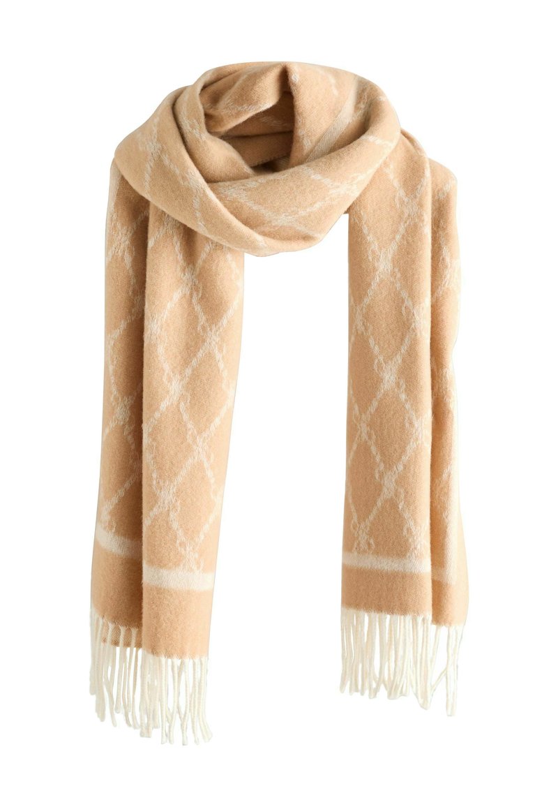 Peach woven scarf with white diamond pattern and fringed ends. Soft texture, lightweight design, suitable for layering and warmth.