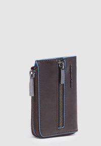 Brown leather wallet with blue zipper accents, featuring a vertical orientation and textured finish. Thin profile with a sleek design.