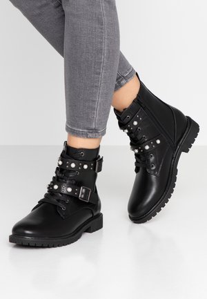 Botines camperos - black
