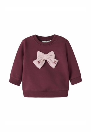 Bordeaux sweatshirt met een roze stoffen strik aan de voorkant. Lange mouwen, geribde manchetten en zoom, zachte textuur en geborduurde details.