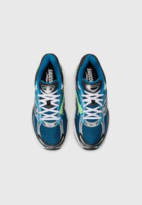 Pair of blue Saucony running shoes with white laces and green accents, viewed from above on a plain white background.