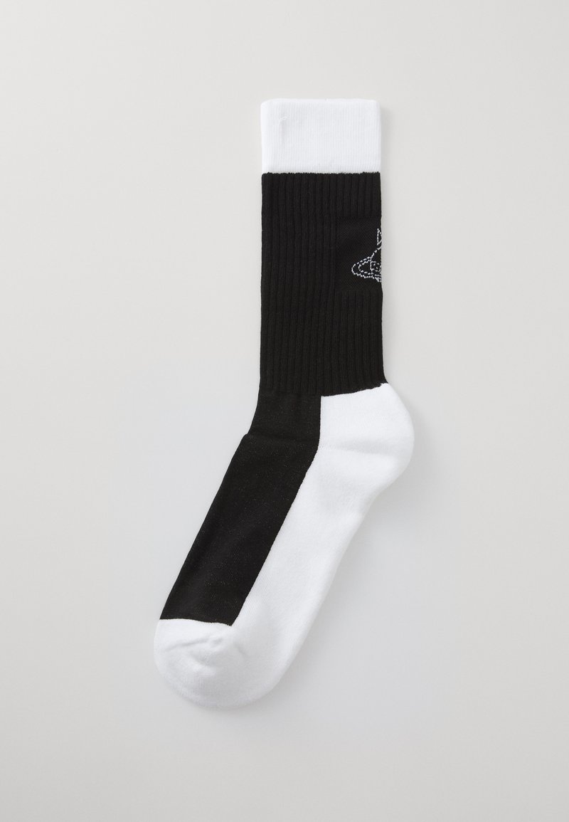 Fekete-fehér bokazokni bordázott mintával. A fekete rész a lábujjtól a közepéig terjed, míg a fehér rész a tetején található.