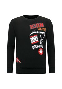 Zwarte sweatshirt met lange mouwen, voorzien van verschillende kleurrijke gedrukt patches, waaronder tekst en een grafiek van een esdoornblad.