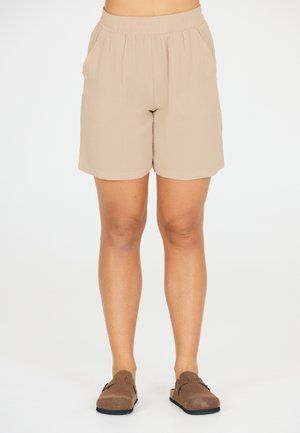 Beige, træk-på shorts lavet af letvægtsstof med elastisk talje og sidelommer, med en struktureret, krøllet overflade.