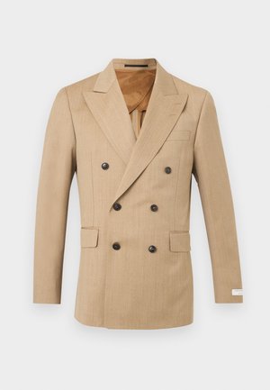 Bežs divrindu vīriešu žakete ar šauriem atloki, sešām tumšām pogām, atloku kabatām un gludu brūnu oderējumu.