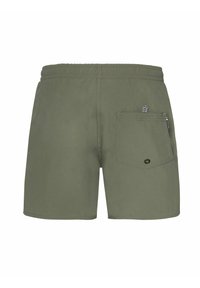 Zielone kąpielówki wykonane z lekkiego materiału, z tylną kieszenią w zygzakowaty wzór oraz elastyczną talią dla wygody.