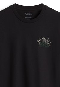 Black cotton t-shirt with a crew neck, featuring a textured green and white graphic logo on the left chest area.