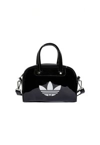 Black patent leather handbag with double handles and a detachable shoulder strap. Features a large white Adidas logo on the front.