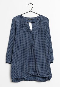 Túnica blu con motivo, a maniche lunghe, con scollatura a chiave e orlo arricciato. Il materiale sembra leggero con una texture morbida.