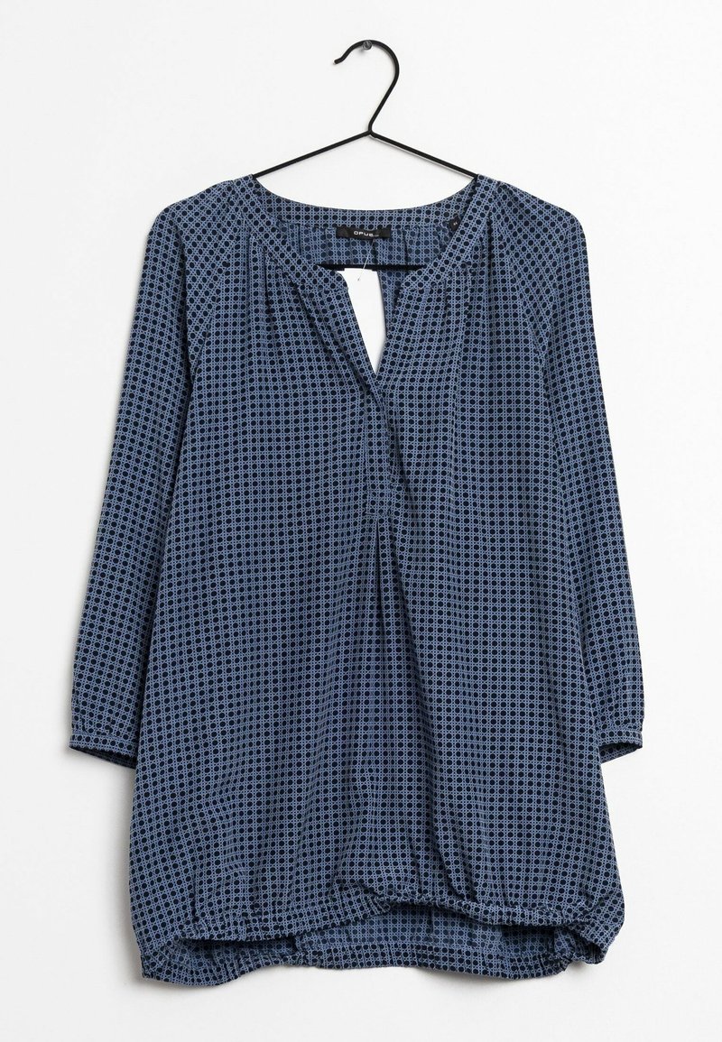 Túnica blu con motivo, a maniche lunghe, con scollatura a chiave e orlo arricciato. Il materiale sembra leggero con una texture morbida.