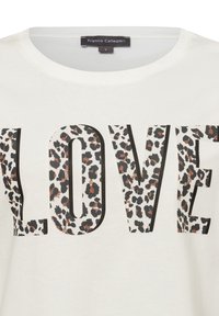 White T-shirt featuring large "LOVE" text in a leopard print pattern with black and copper accents. Round neckline and soft fabric.
