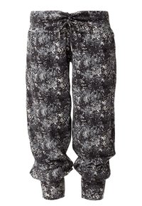 Svart och gråmönstrade tapered byxor med dragsko i midjan och samlade manschetter, tillverkade av ett mjukt, strukturerat tyg.