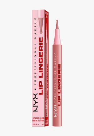 Stylo contour des lèvres avec pointe en feutre, dans un récipient rose et une boîte assortie. L'étiquette présente un texte noir gras sur un fond rose.