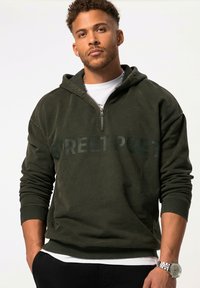 Felpa verde scuro con zip, con il testo "STREET POET" in finitura opaca. Realizzata in un tessuto morbido con polsini e orlo a coste.