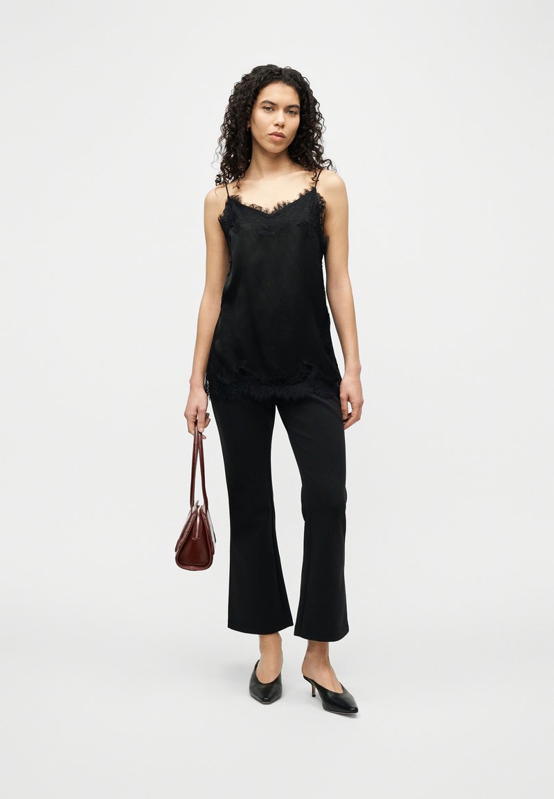 Calvin Klein SPACER FIT FLARE PANT - Kalhoty - black