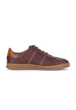 Brown leather sneaker with tan laces, tan heel accent, and a tan rubber sole, viewed from the side against a white background.