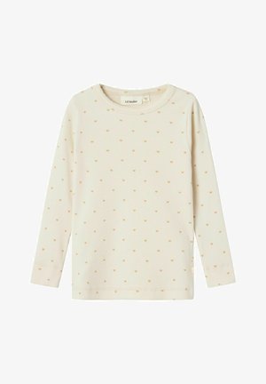 Top a maniche lunghe color crema chiaro realizzato in tessuto a coste. Presenta piccoli motivi a forma di cuore marrone chiaro distribuiti uniformemente. Collo a giro e maniche con polsino.