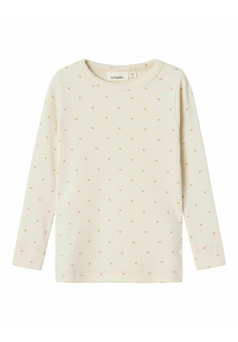 Top a maniche lunghe color crema chiaro realizzato in tessuto a coste. Presenta piccoli motivi a forma di cuore marrone chiaro distribuiti uniformemente. Collo a giro e maniche con polsino.