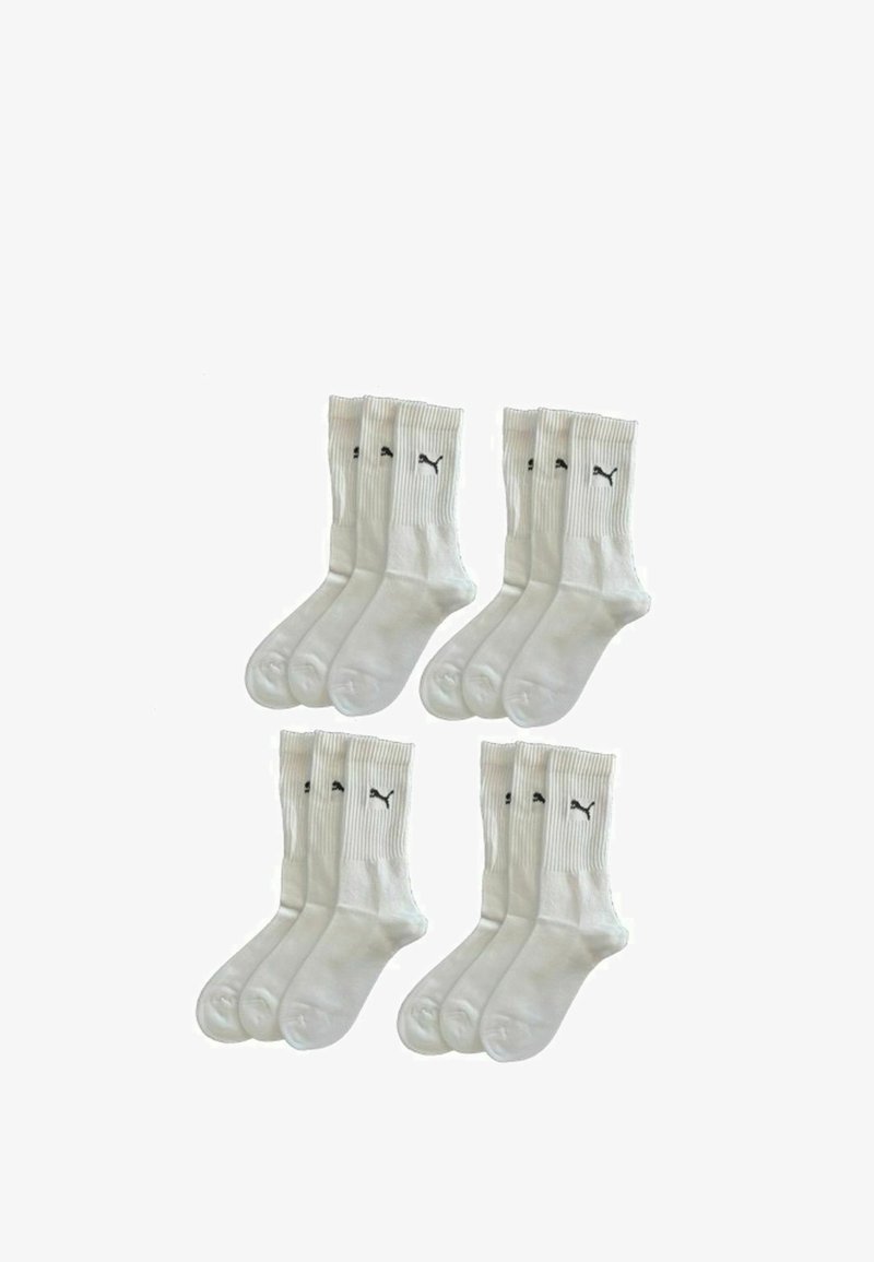 Weiße Baumwoll-Sportsocken mit ribbed Design und schwarzen Logo-Akzenten. Set enthält sechs Paare. Glatte Textur, mittellange Länge.