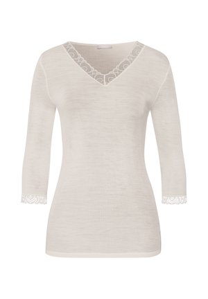 Maglietta a maniche lunghe di un beige chiaro con scollatura a V, rifinita con pizzo attorno al collo e ai polsini, caratterizzata da una texture a costine.