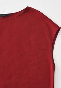 Rotes T-Shirt mit kurzen Ärmeln aus glattem Stoff und rundem Auschnitt. Enthält ein Etikett mit "someday"-Markierung und Größe 36.