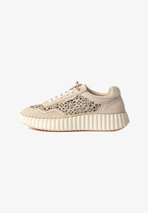Beige sneaker with perforated suede upper, white laces, textured cream sole, and round toe, shown in side profile on white background.