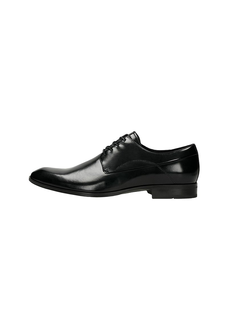 Scarpe eleganti in pelle nera con un design slanciato, punta affusolata e superficie liscia con cuciture minime. Suola piatta in gomma per una maggiore stabilità.