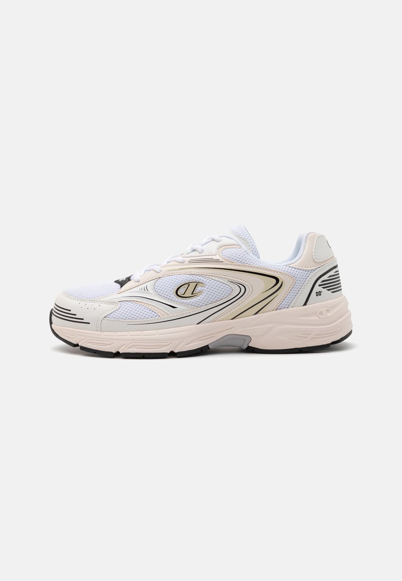 White athletic shoe with mesh fabric, padded tongue, gold accents, black outsole, and streamlined design. Features branding on the side.