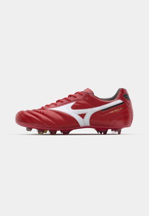 Red soccer cleat with a white logo and accents, made of smooth synthetic material. Features a rounded toe and multiple studs on the outsole.