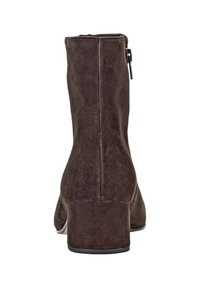 Brown suede ankle boot with a block heel, back zipper, and smooth finish. Features curved contours and stitched detailing.