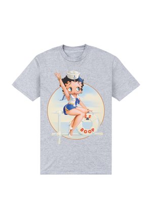 Camiseta gris con un personaje de dibujos animados vestido de marinero, con un salvavidas, gráfico circular y colores vibrantes.