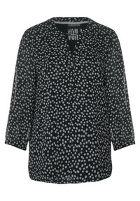 Blouse noire en tissu léger, avec un col en V, des manches trois-quarts et un motif à pois blancs sur toute la surface.