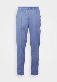 Blaue sportliche Jogginghosen aus weichem Material, mit einem elastischen Taillenbund, Seitentaschen und einem Logo-Akzent am linken Oberschenkel.