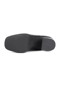Black shoe sole with a smooth, flat design. Includes rubber traction detailing and a rounded toe. No visible branding or accents.