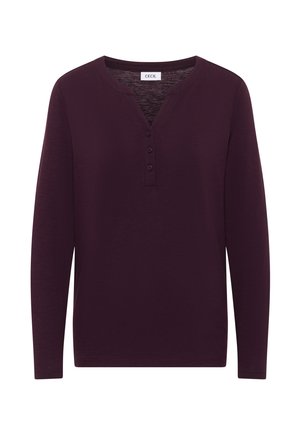 Langarmhemd in donkerpaars met een Henley-kraag, drie knopen en een zachte textuur. Casual ontwerp met een relaxte pasvorm.