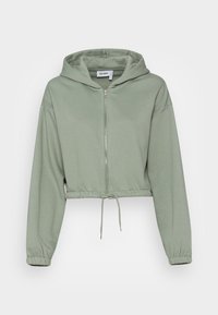 Sweatshirt à capuche court de couleur vert clair, confectionné en tissu doux avec une fermeture éclair à l'avant, des poignets élastiqués et un ourlet avec cordon de serrage.