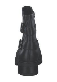 Stivale alla caviglia nero con parte superiore in finta pelle textured, dotato di due cinturini regolabili e un tacco spesso. Imbottitura interna liscia.