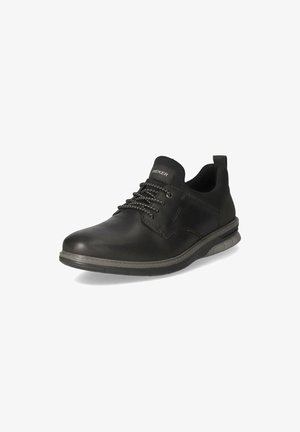 Black leather lace-up shoe with a round toe, cushioned sole, and contrasting grey accents. Features a pull tab at the heel for easy wear.