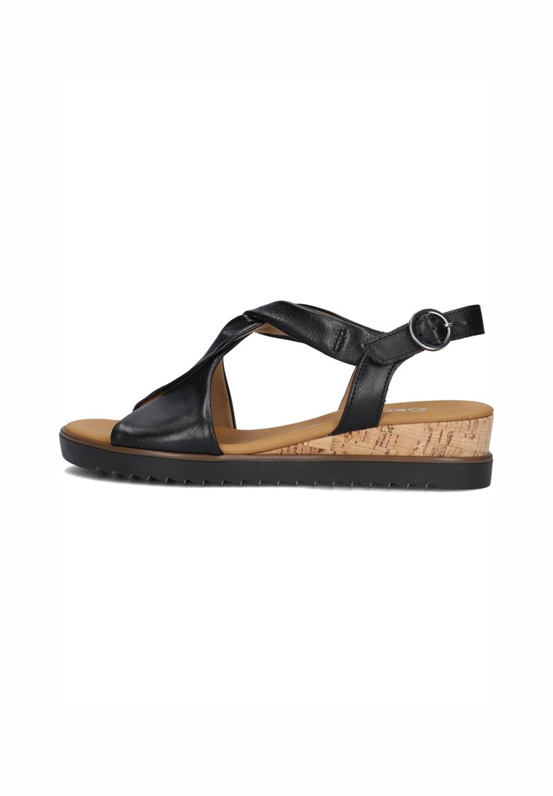 Zwarte leren plateau-sandalen met gekruiste banden, een kurk-textuur middenzool en een rubberen zool. Beschikt over een verstelbare enkelband.
