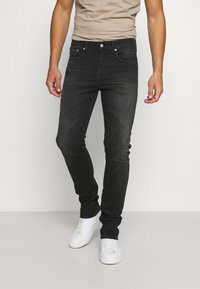 Svarta slim-fit-jeans i denim, med en klassisk femfickorsdesign, knappstängning och subtila blekningsdetaljer på tyget.