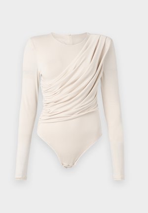 Beige long-sleeve bodysuit with draped front, smooth texture, and snap closure at the bottom. Elegant and fitted design.